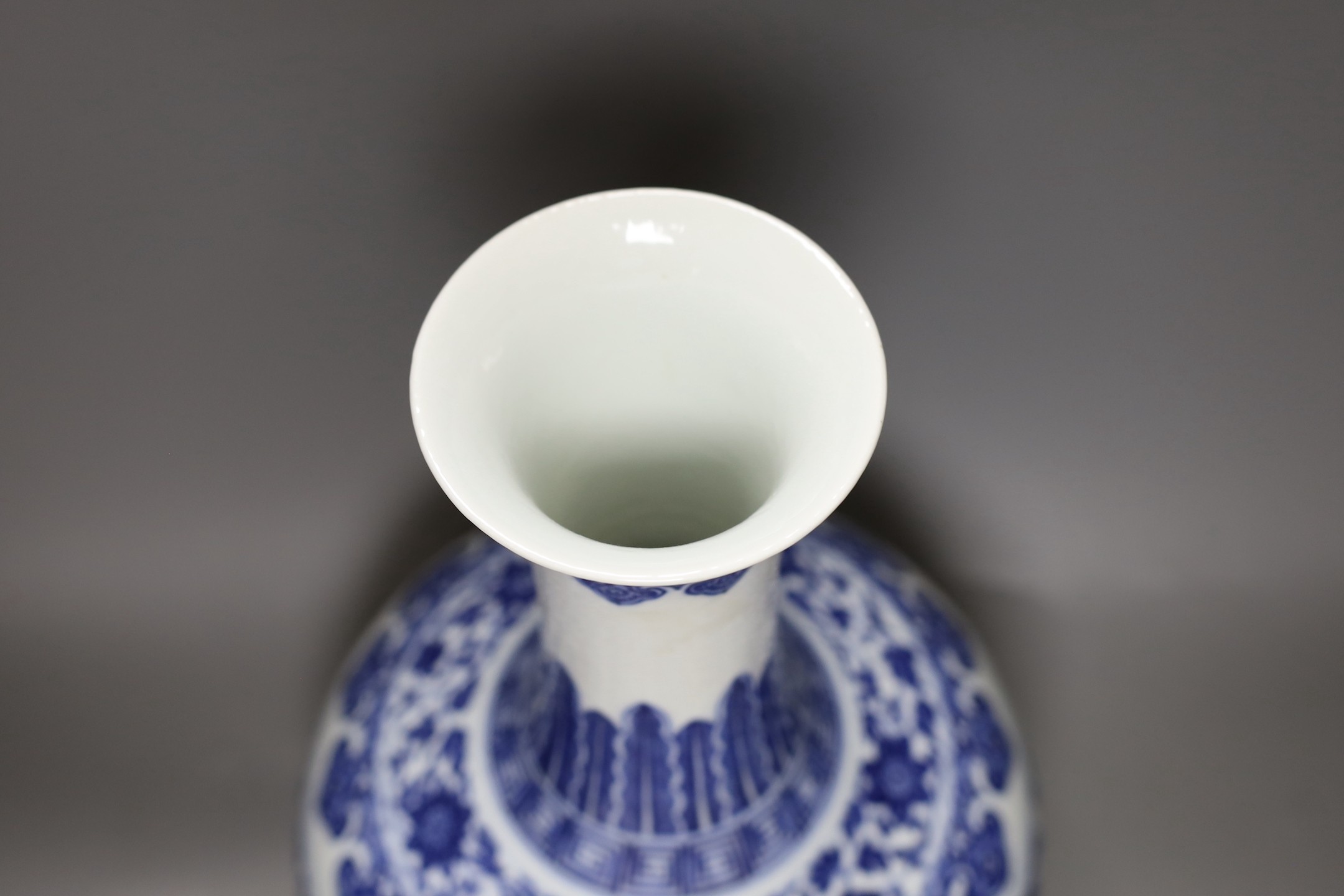 A Chinese blue and white bottle vase, Qianlong seal mark, 37cms high